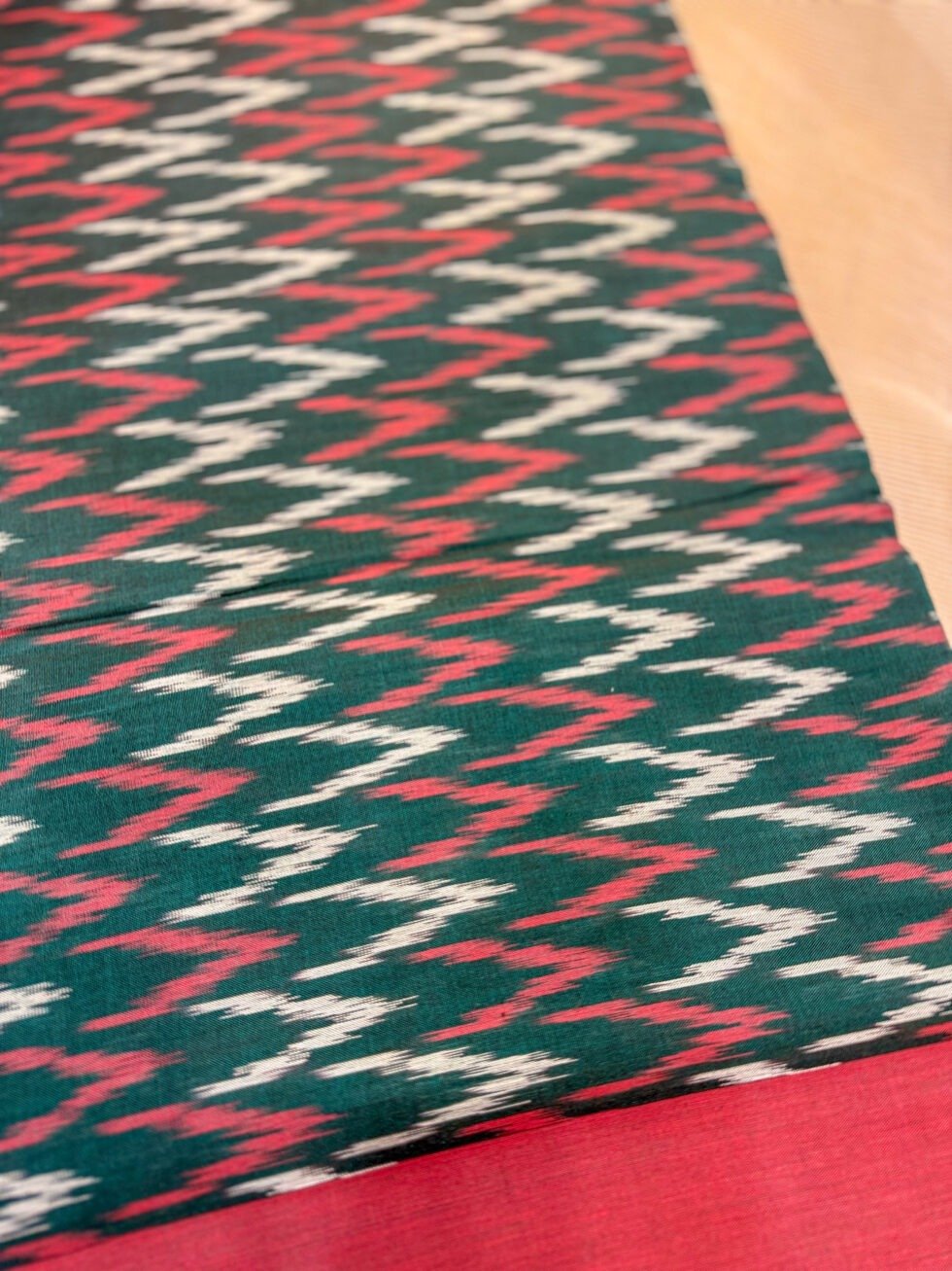 premium-pure-handloom-ikkat-saree-in-bottle-green-and-vermilion-red-for-festive-and-office-wear