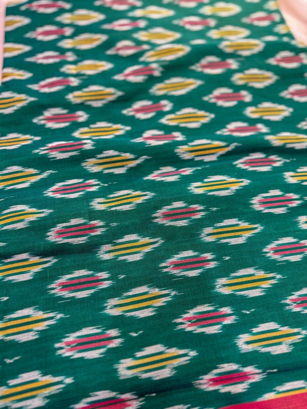 pure-handloom-ikkat-saree-in-bottle-green-and-rani-pink-with-traditional-ikkat-motifs